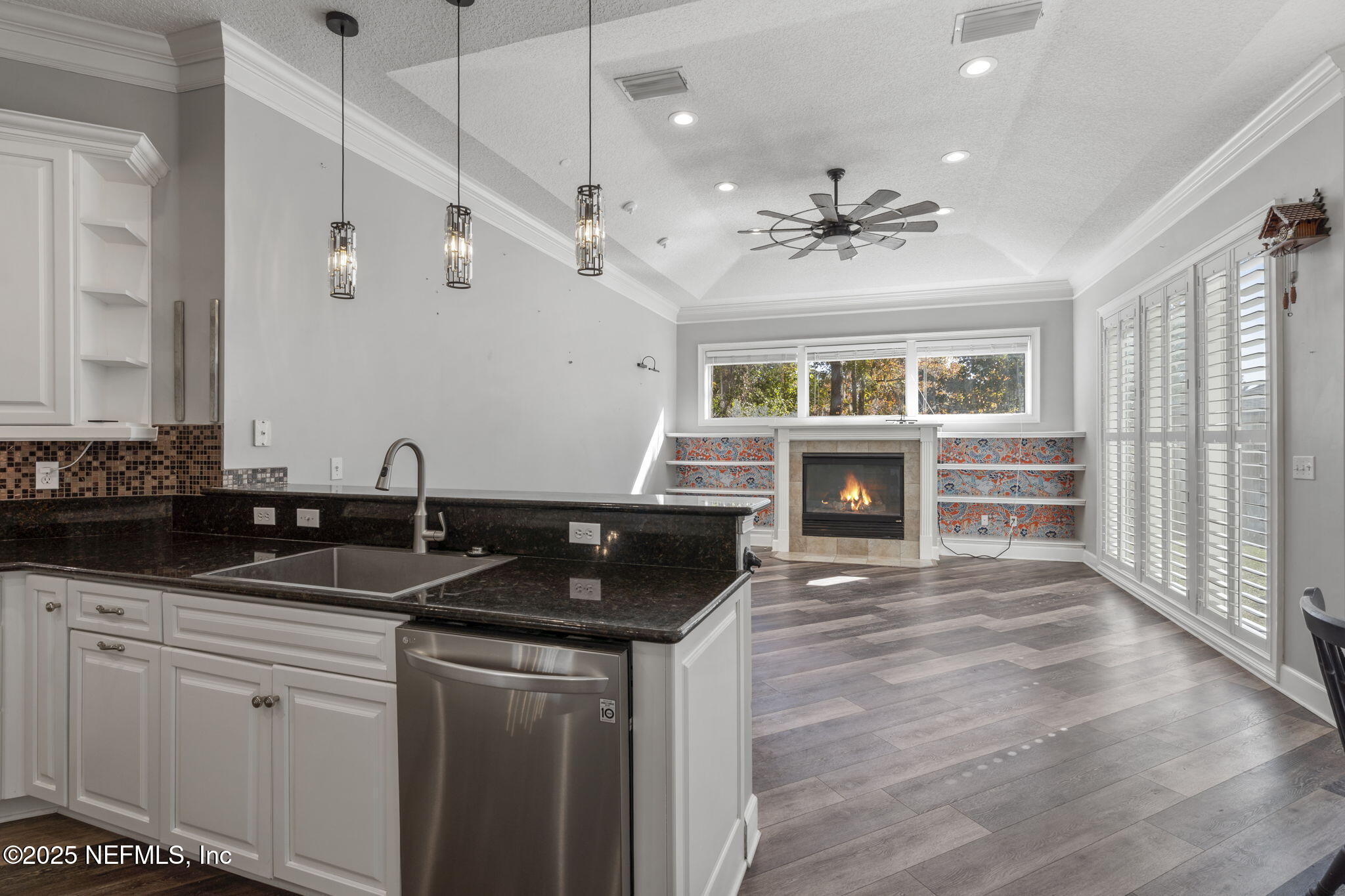 932 Clay Street Fleming Island, FL 32003 - Photo 11 of 50 a kitchen with granite countertop a sink and stove