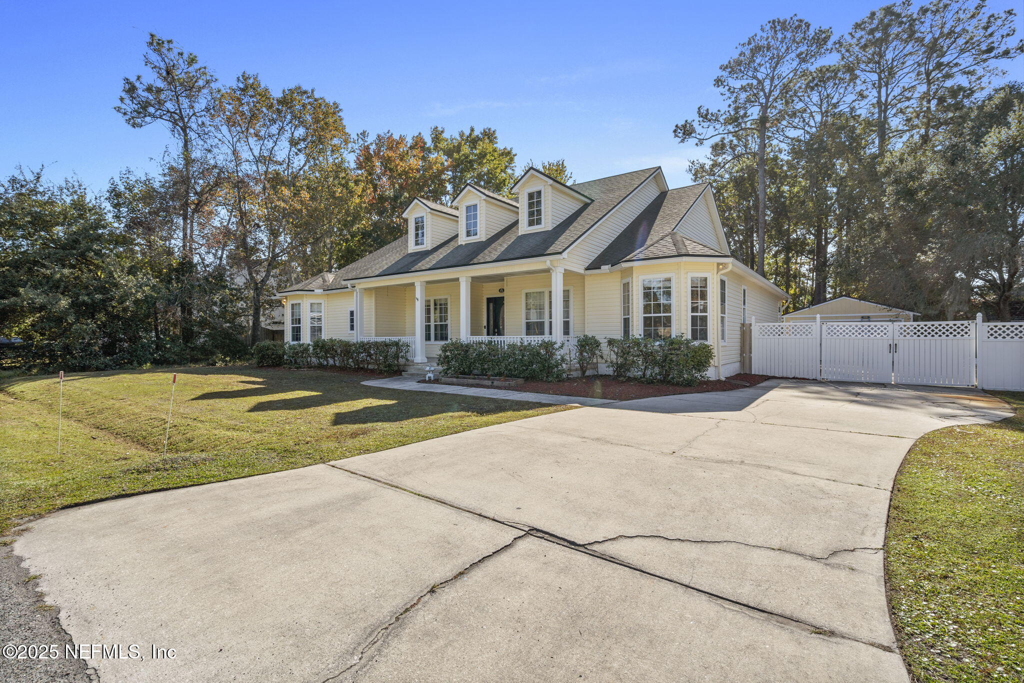 932 Clay Street Fleming Island, FL 32003 - Photo 47 of 50 a view of a house with a swimming pool and a yard