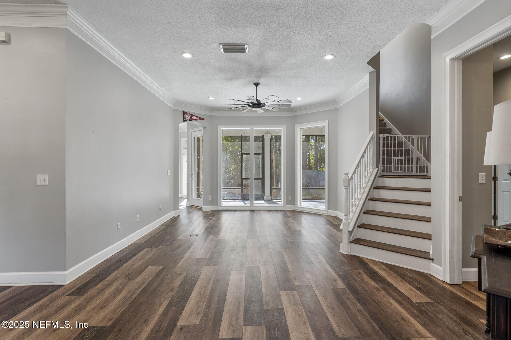 932 Clay Street Fleming Island, FL 32003 - Photo 8 of 50 wooden floor in an empty room with a window