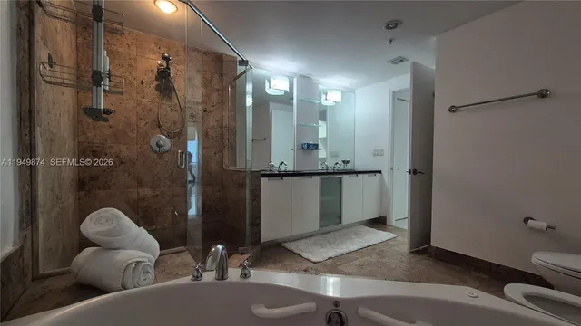 a living room with furniture a rug and a large window