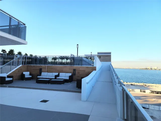 a view of a balcony with lake view and mountain view