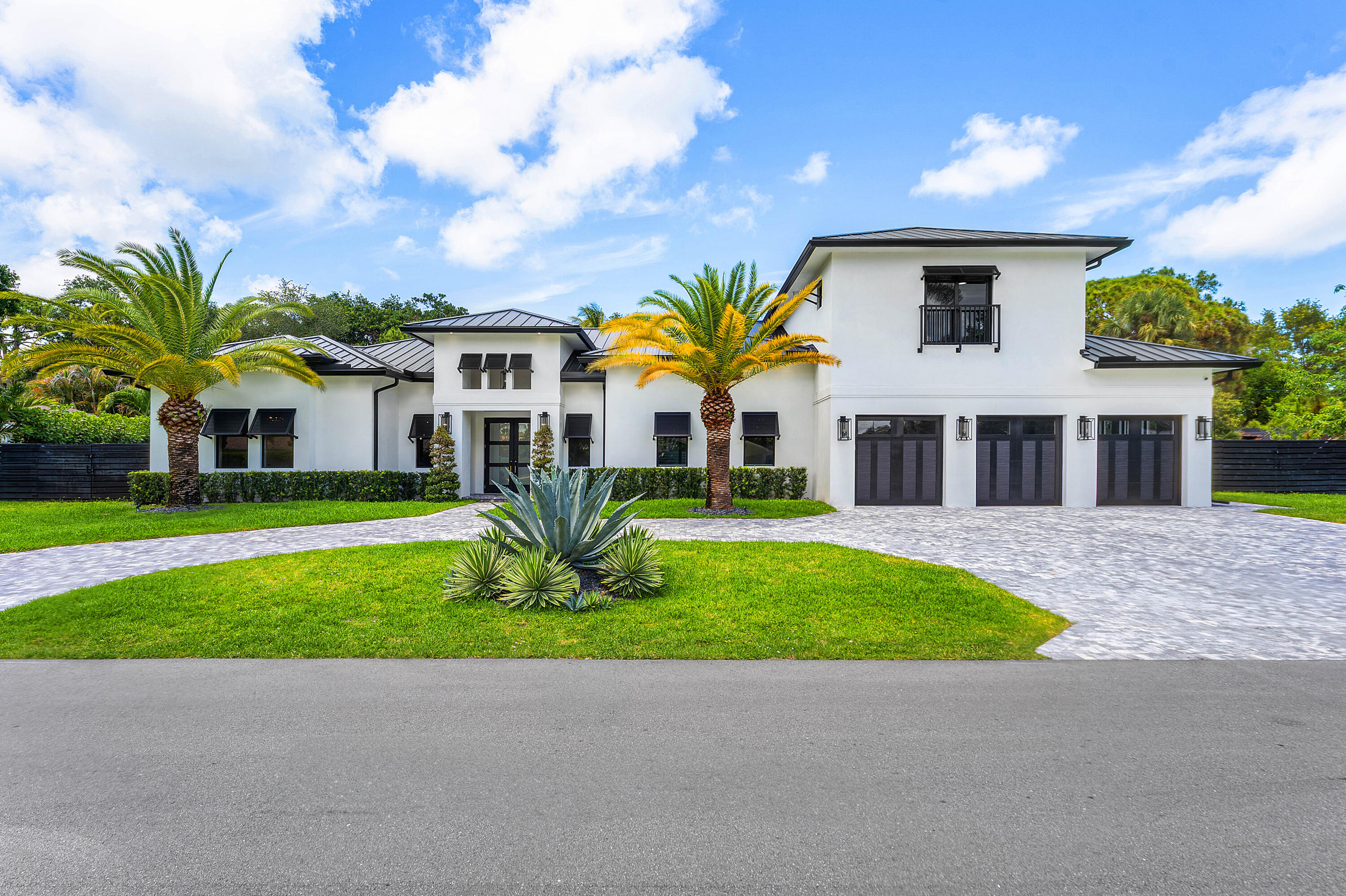 5701 Old Orange Road Jupiter, FL 33458 - Photo 3 of 46 a front view of house with yard and green space
