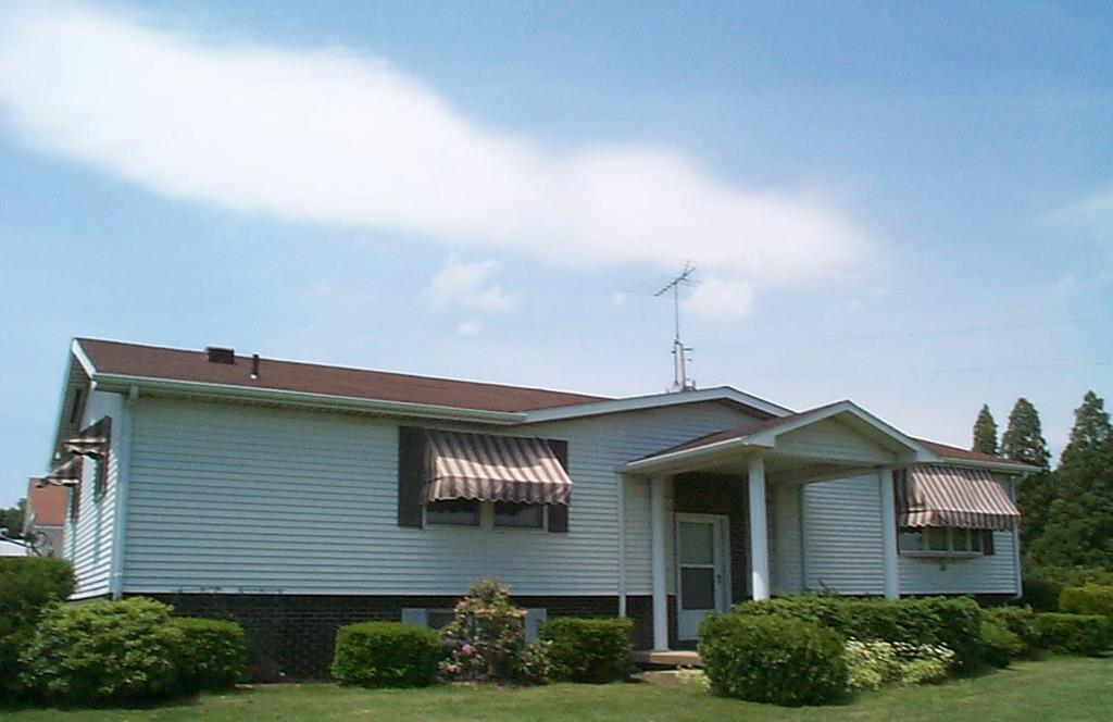 1007 Old Rte 8 Polk, PA 16342 - Photo 1 of 1 a front view of a house with garden