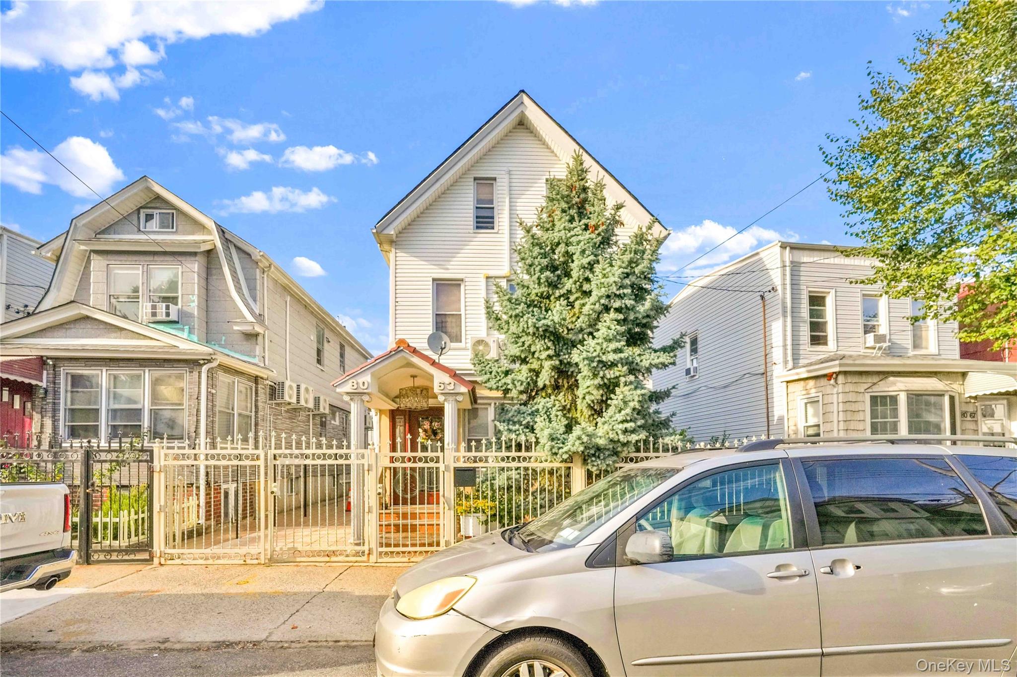 80-63 87th Road Queens, NY 11421 - Photo 3 of 50 View of front facade with a gate