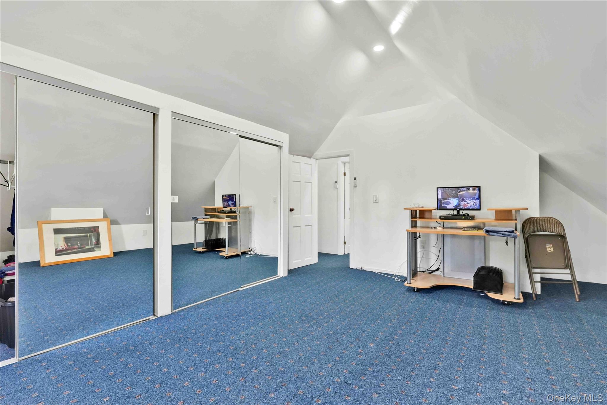 80-63 87th Road Queens, NY 11421 - Photo 45 of 50 Bedroom with lofted ceiling and carpet floors