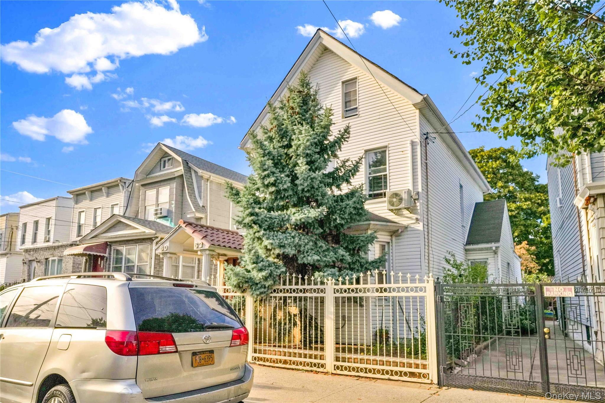 80-63 87th Road Queens, NY 11421 - Photo 5 of 50 View of front facade with a fenced front yard and a gate