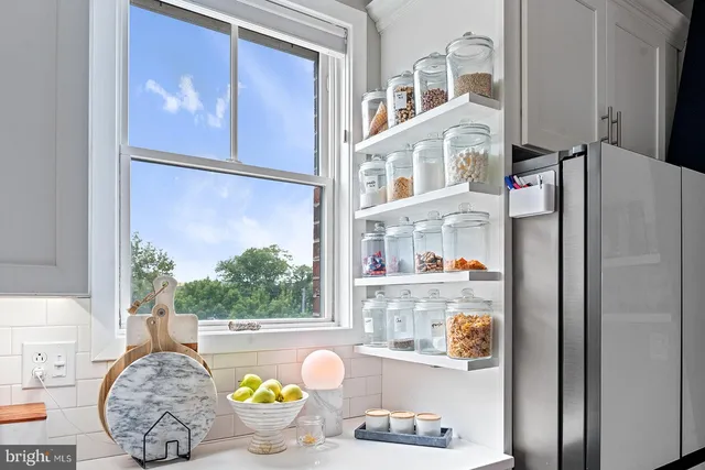 a stove top oven sitting inside of a kitchen