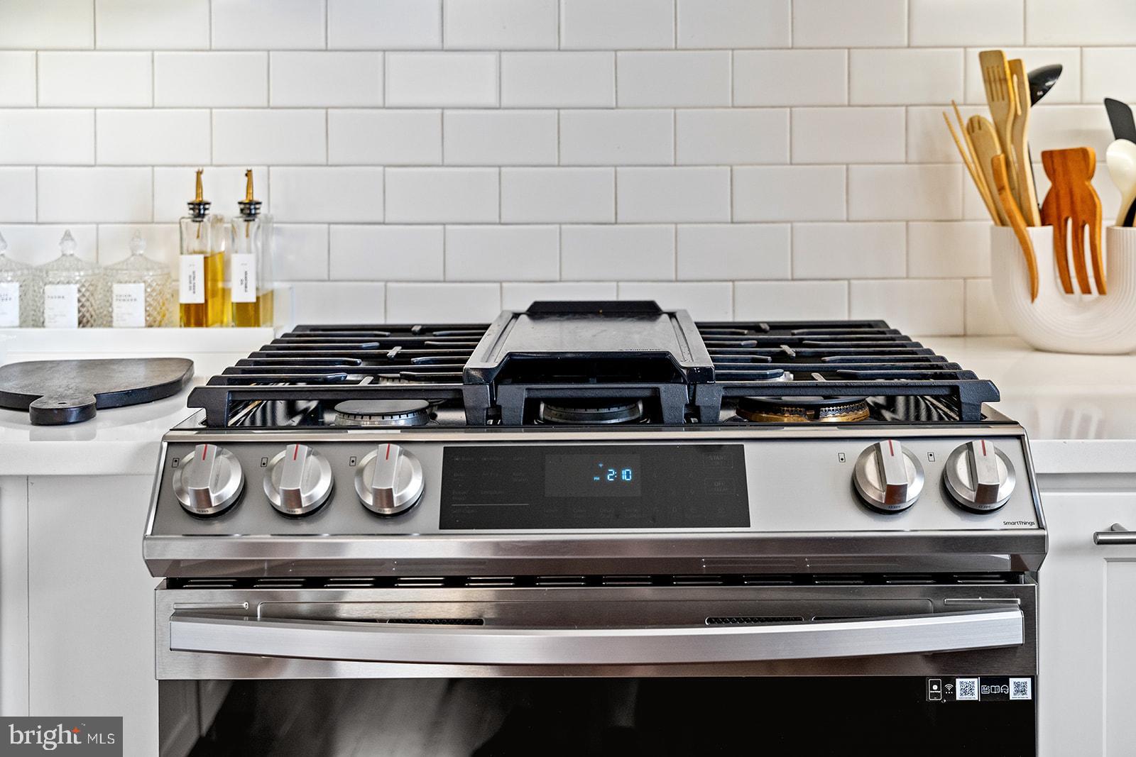 181 East Reed Avenue, Unit 207 Alexandria, VA 22305 - Photo 20 of 41 a stove top oven sitting inside of a kitchen