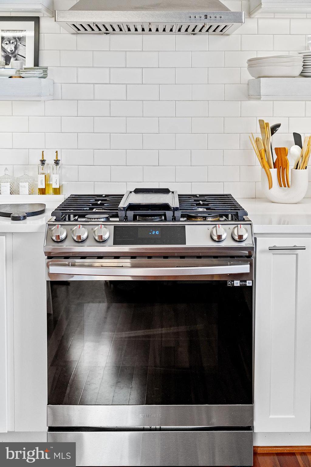 181 East Reed Avenue, Unit 207 Alexandria, VA 22305 - Photo 22 of 41 a stove top oven sitting inside of a kitchen