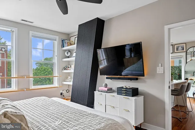 a bathroom with a toilet sink and shower