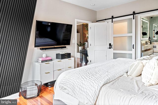a bathroom with a shower sink and mirror