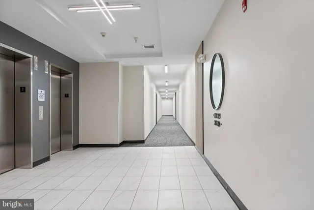 a view of a small space with wooden floor