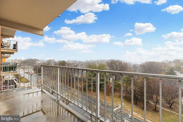 a view of balcony with furniture