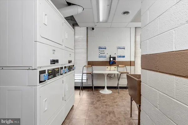 a kitchen with a sink and white cabinets