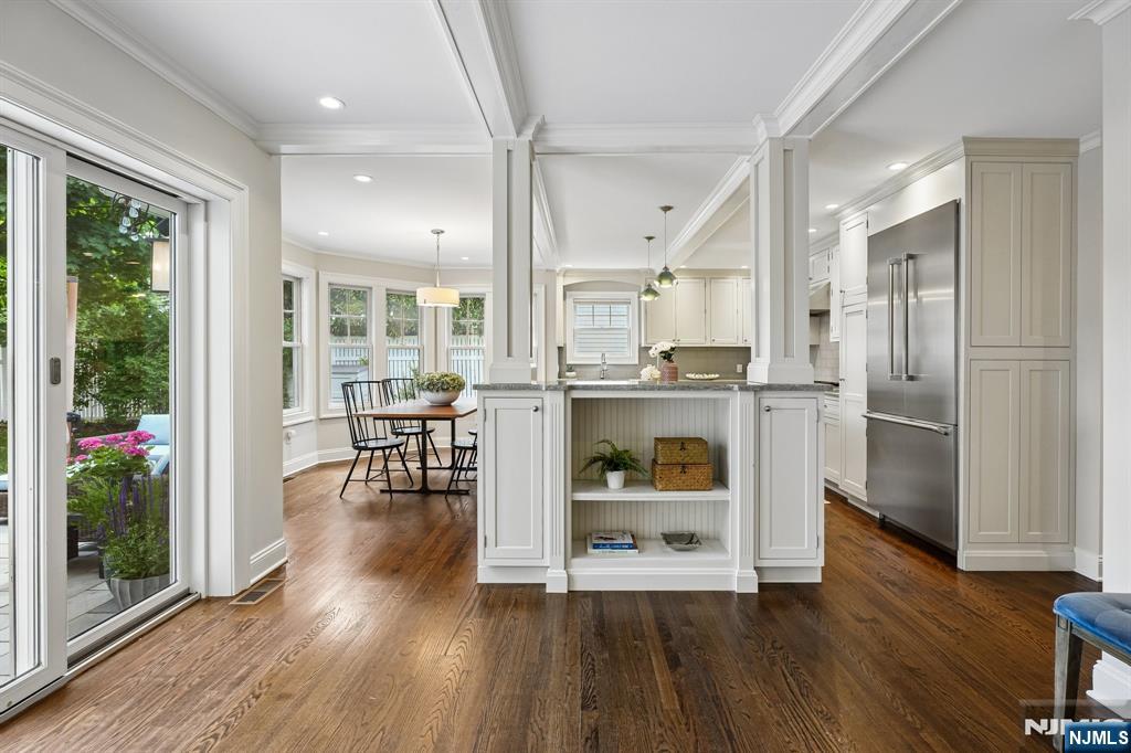 11 Mt Vernon Road Montclair, NJ 07043 - Photo 13 of 49 a kitchen with stainless steel appliances wooden floor and a refrigerator