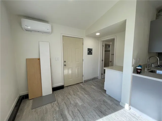 a view of a kitchen from a hallway
