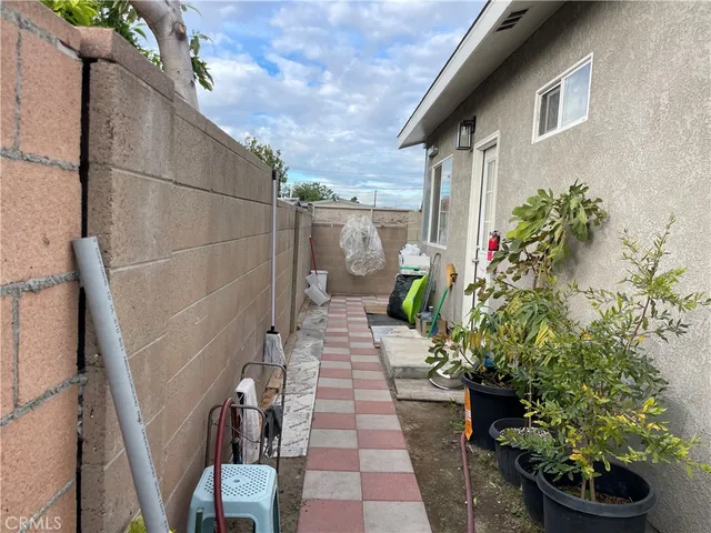 a kitchen with granite countertop a sink stainless steel appliances and cabinets