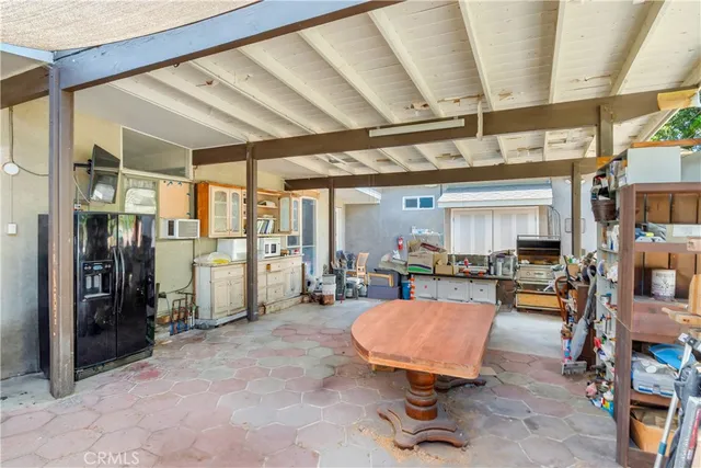 a room with lots of furniture and a chandelier