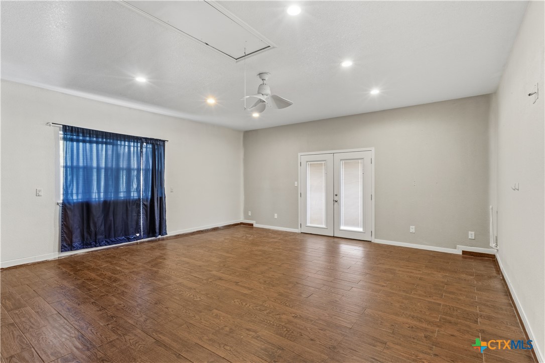 283 County Road 4710 Kempner, TX 76539 - Photo 35 of 47 a view of an empty room with wooden floor and a window