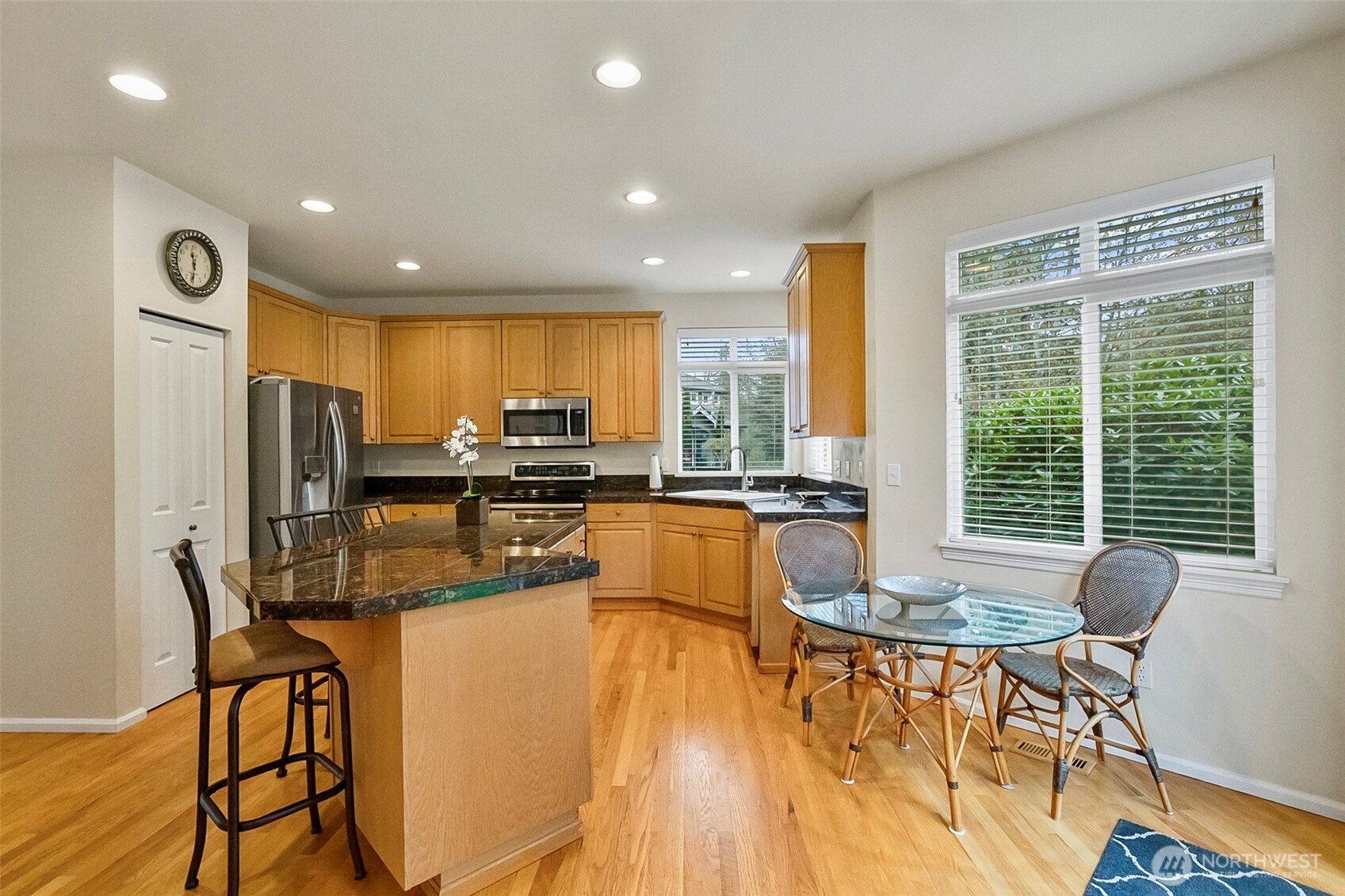17401 33rd Drive Southeast Bothell, WA 98012 - Photo 12 of 39 a dining hall with stainless steel appliances a dining table and chairs