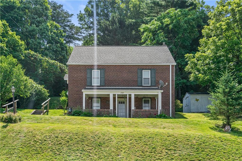a front view of a house with a yard