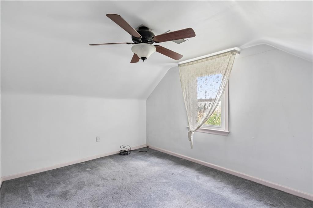 2509 Kane Road Aliquippa, PA 15001 - Photo 16 of 27 an empty room with windows and ceiling fan