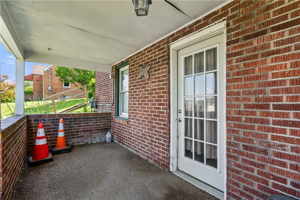 2509 Kane Road Aliquippa, PA 15001 - Photo 22 of 27 a yellow room with wooden walls and iron gate