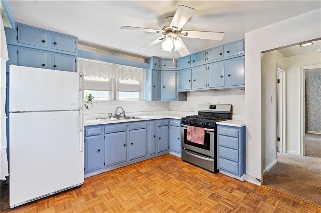 2509 Kane Road Aliquippa, PA 15001 - Photo 4 of 27 a kitchen with granite countertop a sink stainless steel appliances and cabinets