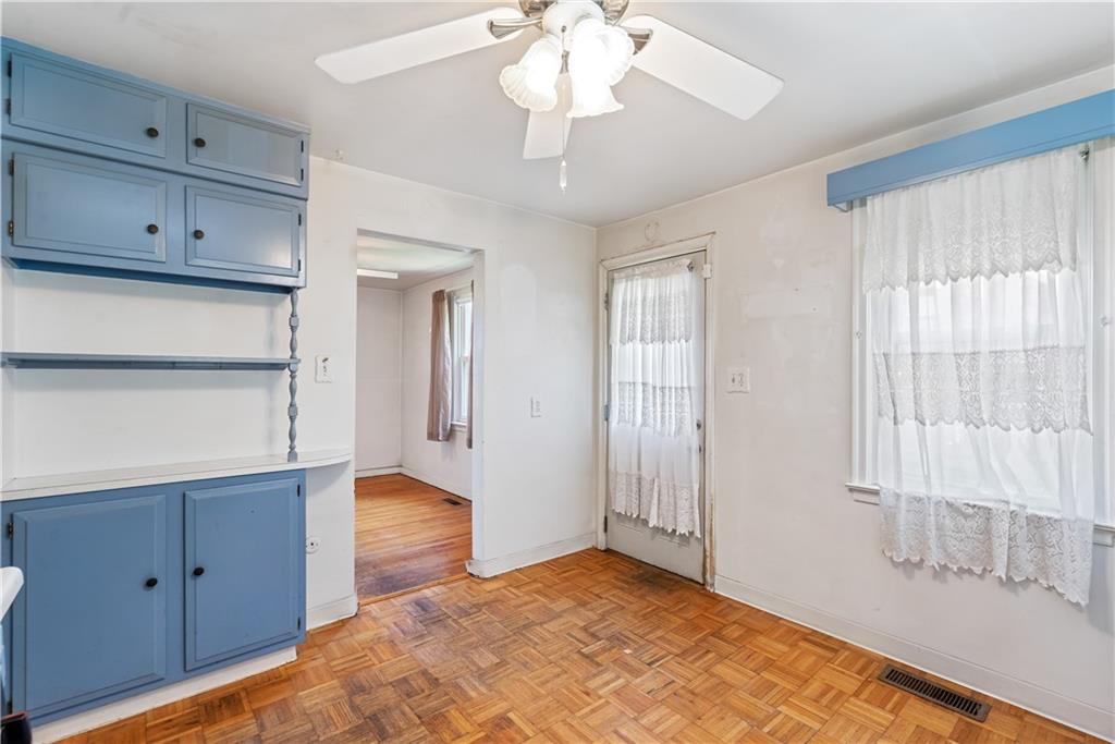 2509 Kane Road Aliquippa, PA 15001 - Photo 6 of 27 a bedroom with a bed and a chandelier