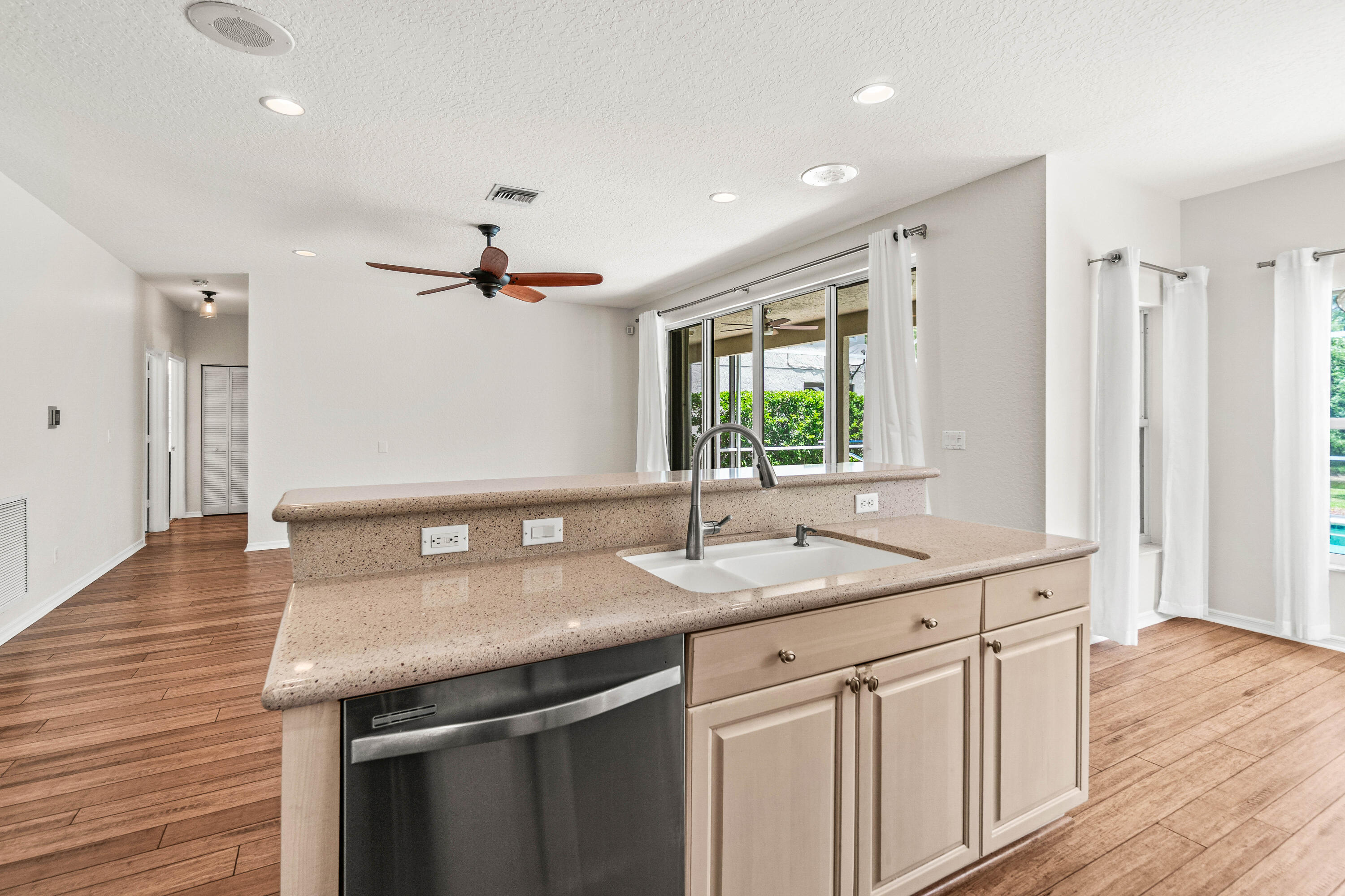 207 Pennock Trace Drive Jupiter, FL 33458 - Photo 14 of 48 a kitchen with a sink and a wooden floor