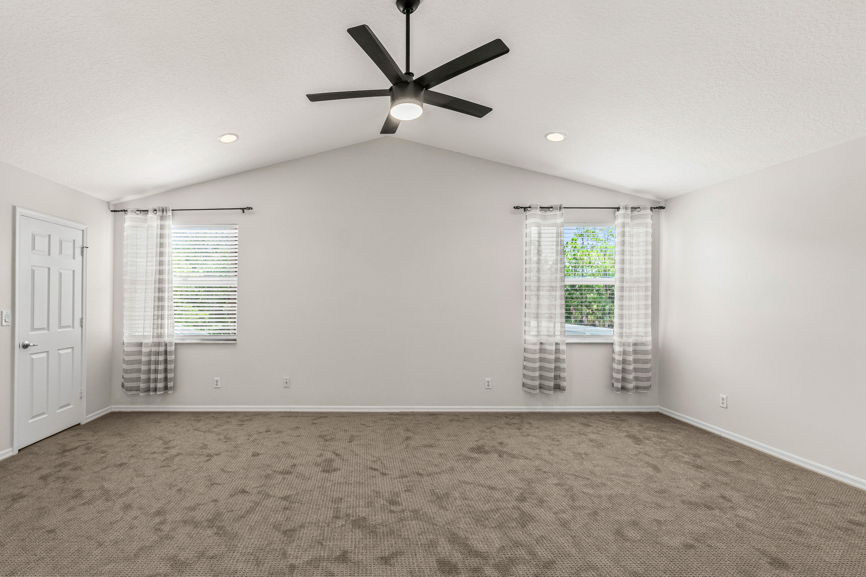 207 Pennock Trace Drive Jupiter, FL 33458 - Photo 15 of 48 an empty room with a empty space and a ceiling fan