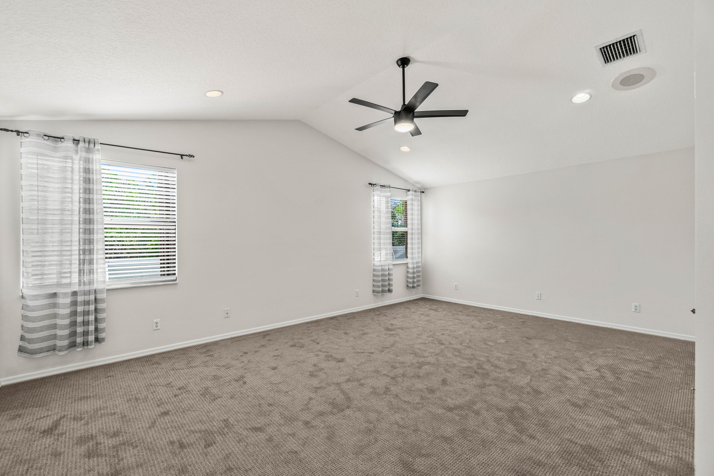 207 Pennock Trace Drive Jupiter, FL 33458 - Photo 16 of 48 a view of an empty room with a window