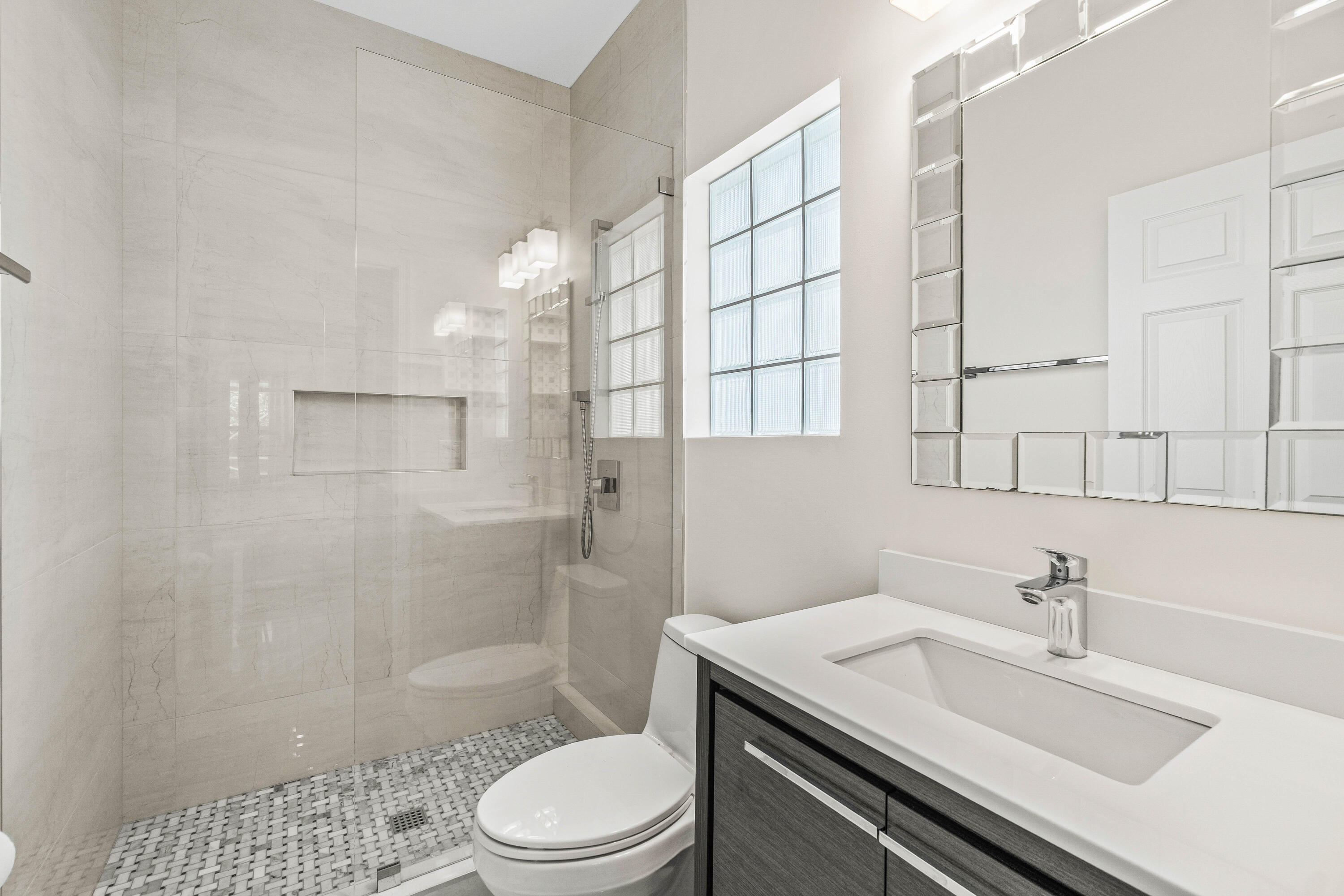 207 Pennock Trace Drive Jupiter, FL 33458 - Photo 28 of 48 a bathroom with a sink a toilet and shower