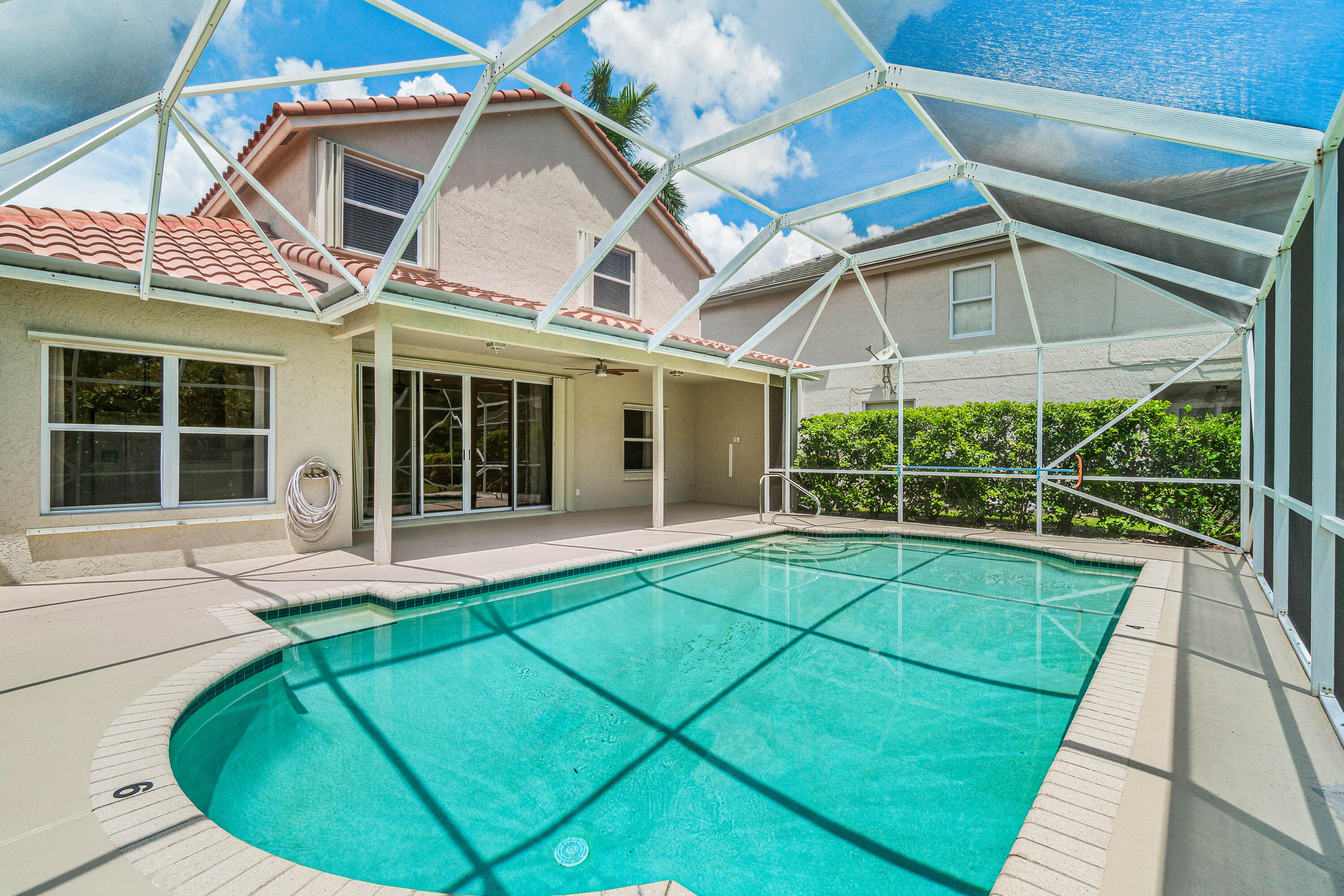 207 Pennock Trace Drive Jupiter, FL 33458 - Photo 34 of 48 a view of a house with a swimming pool