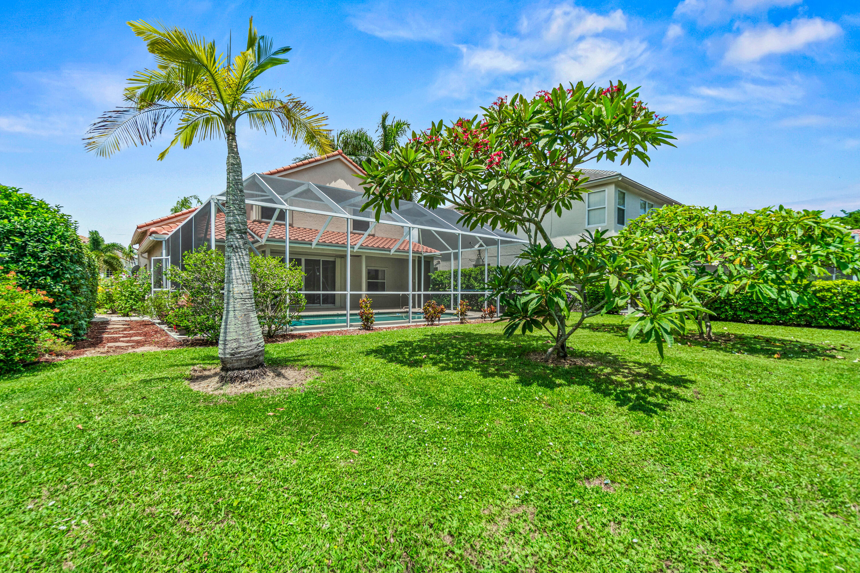 207 Pennock Trace Drive Jupiter, FL 33458 - Photo 36 of 48 a view of a house with a backyard