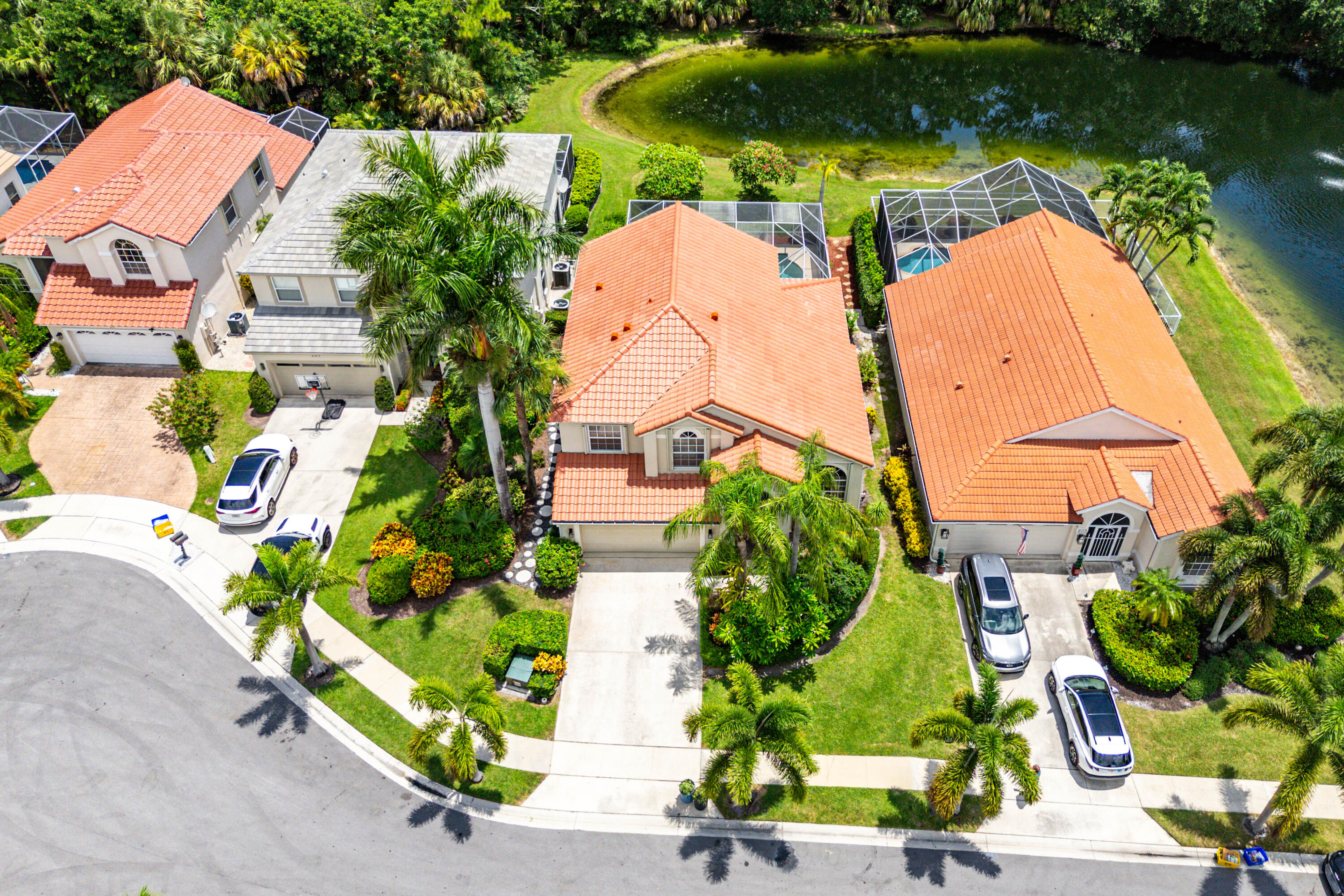 207 Pennock Trace Drive Jupiter, FL 33458 - Photo 40 of 48 an aerial view of a house with a garden and lake view