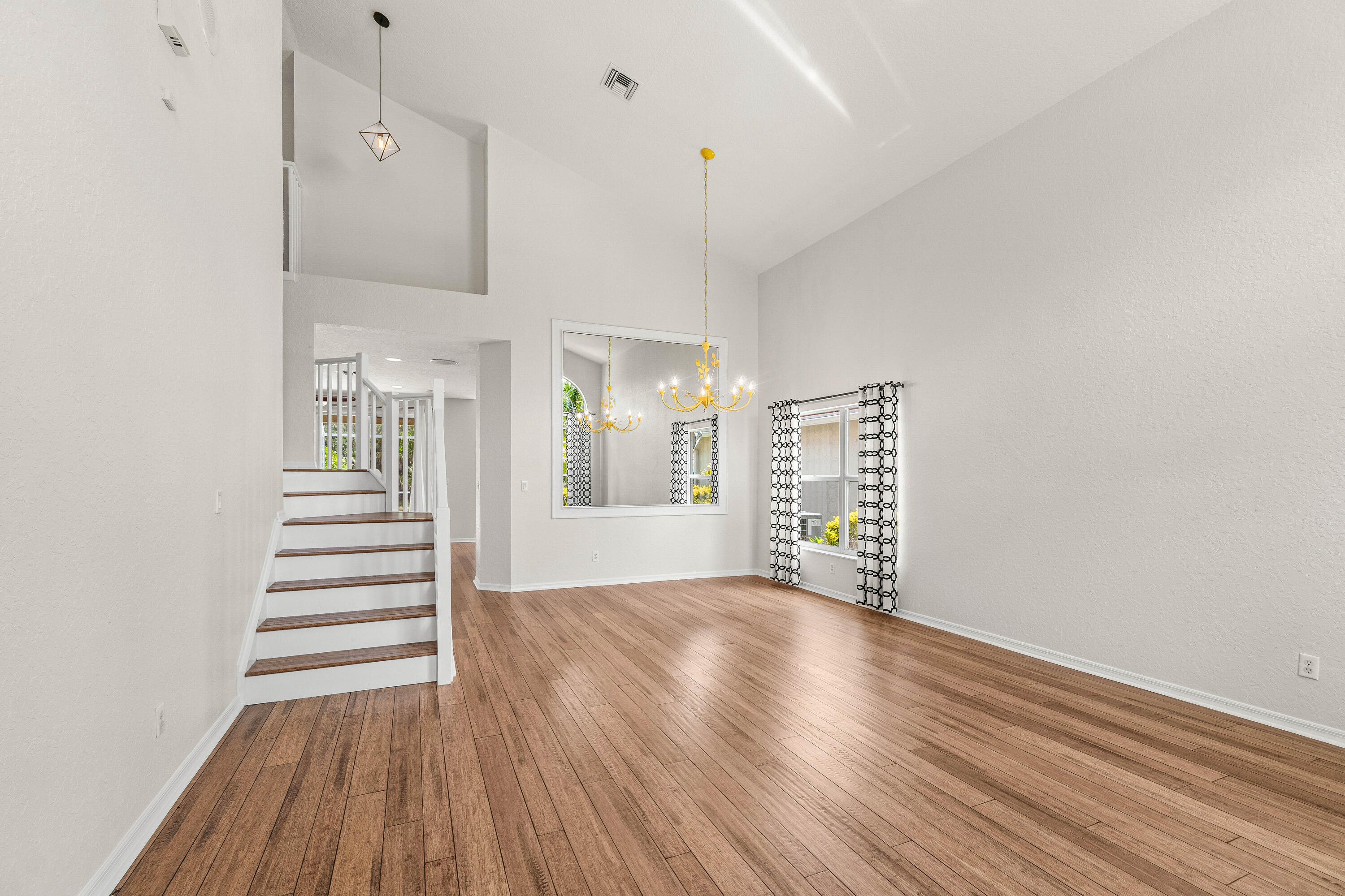 207 Pennock Trace Drive Jupiter, FL 33458 - Photo 5 of 48 a view of a kitchen with wooden floor and window
