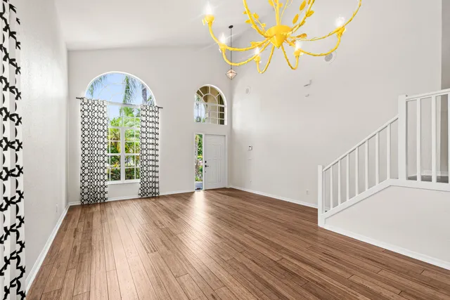 a view of an entryway with wooden floor