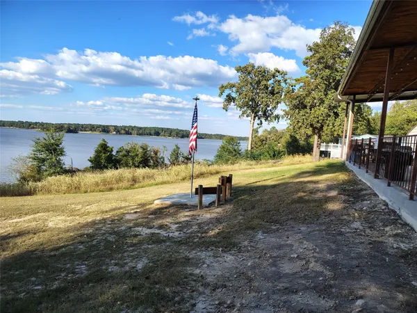 a view of a lake with a yard