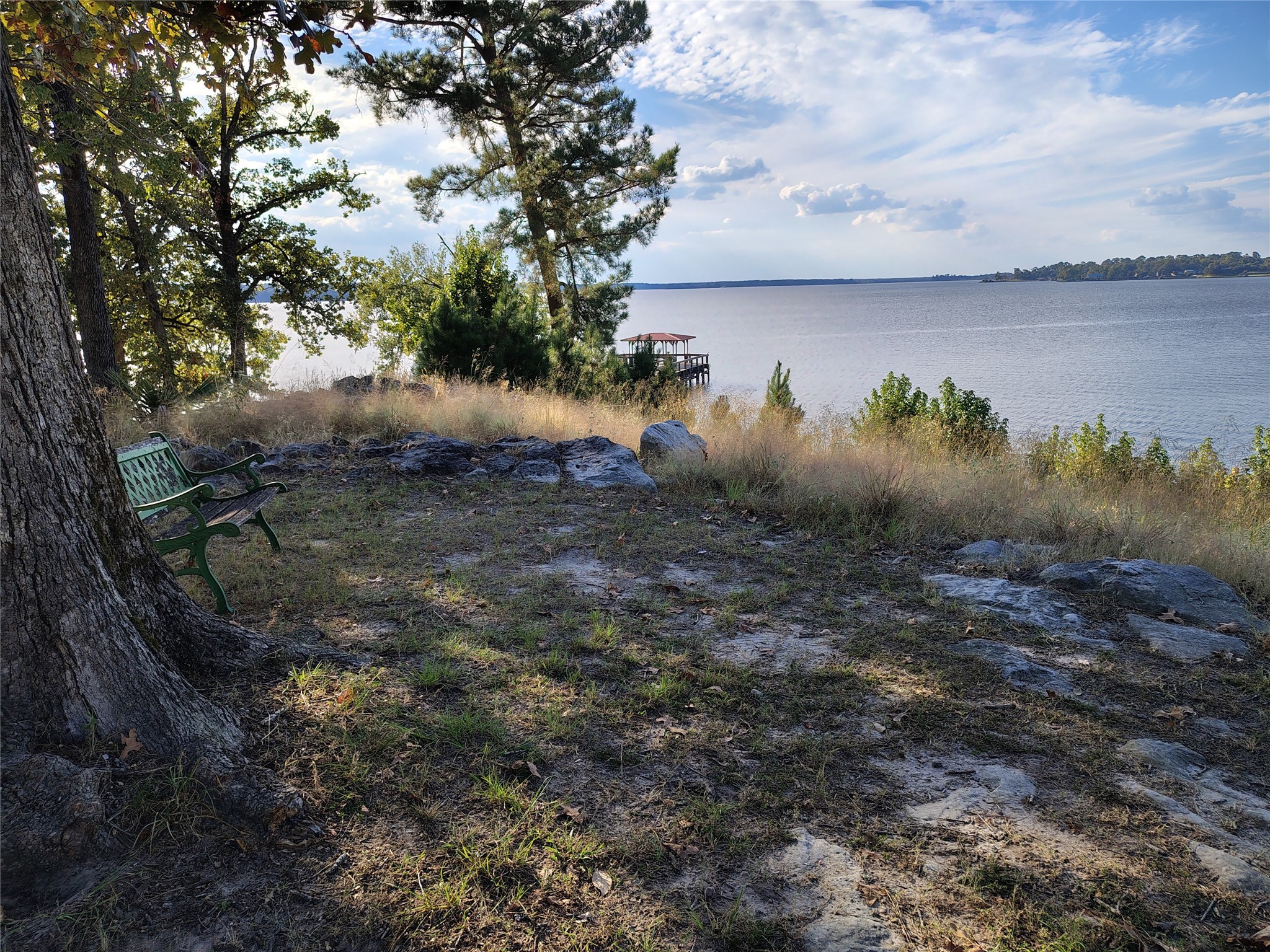 404 Lakeside Loop Trinity, TX 75862 - Photo 15 of 17 a view of a lake next to a building