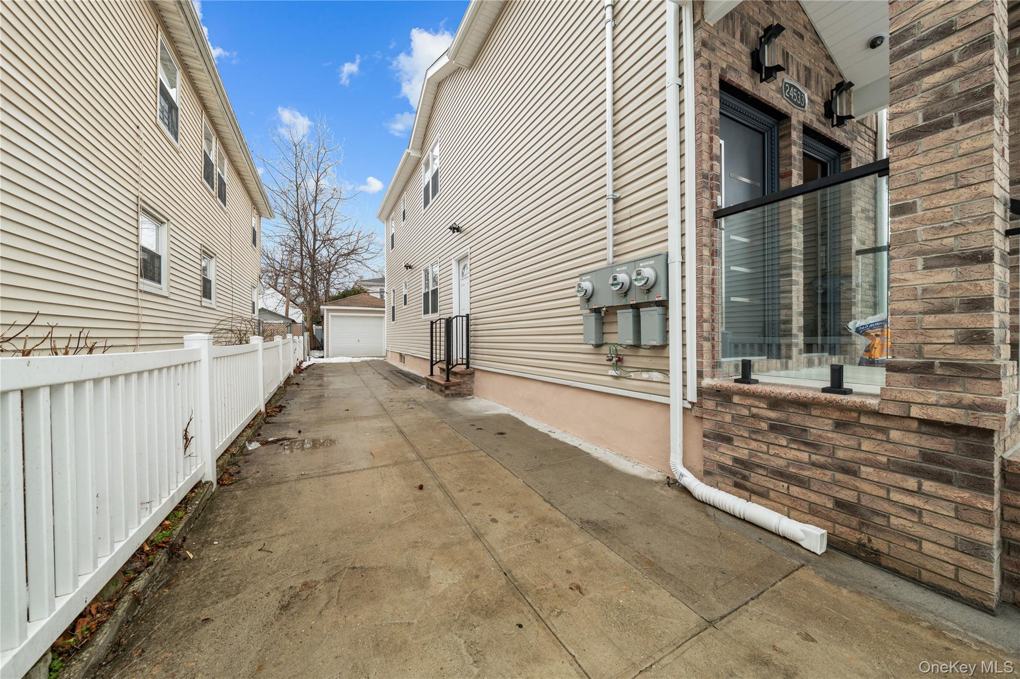 245-33 147th Road, Unit 2 Queens, NY 11422 - Photo 13 of 17 a view of a back yard of the house