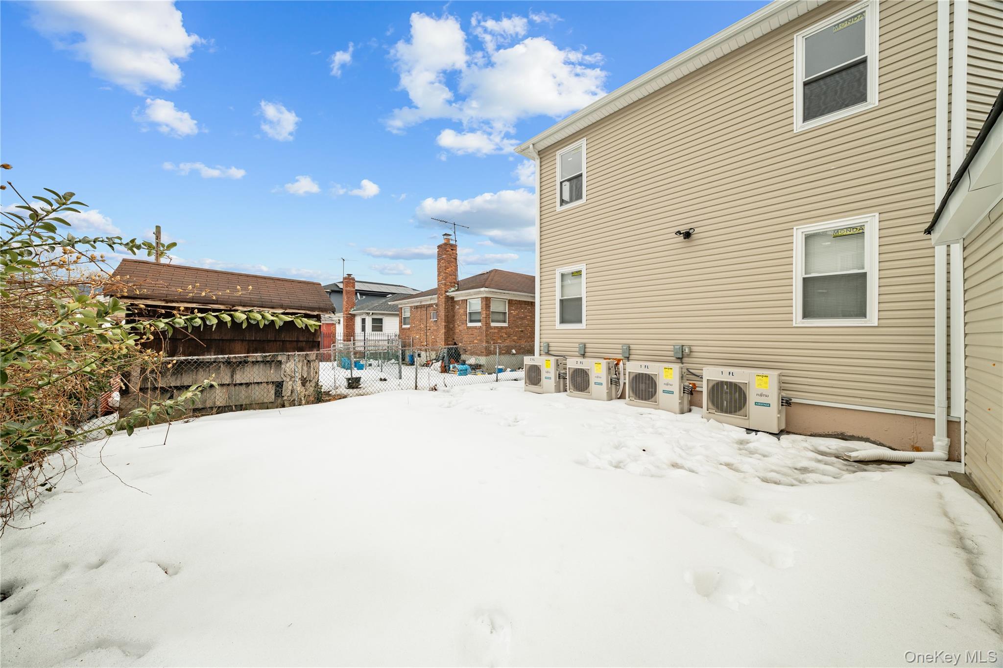 245-33 147th Road, Unit 2 Queens, NY 11422 - Photo 16 of 17 a view of a terrace with a barbeque