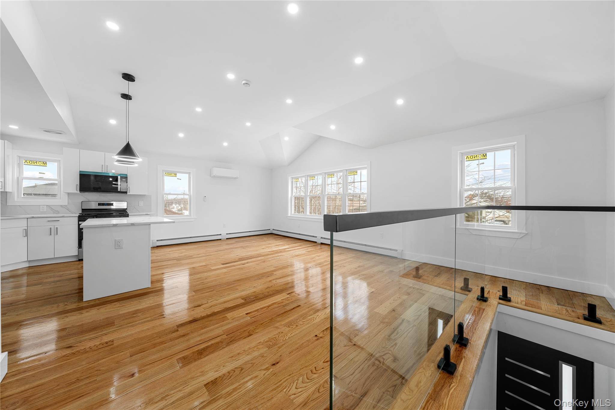 245-33 147th Road, Unit 2 Queens, NY 11422 - Photo 3 of 17 a view of kitchen and hall with wooden floor