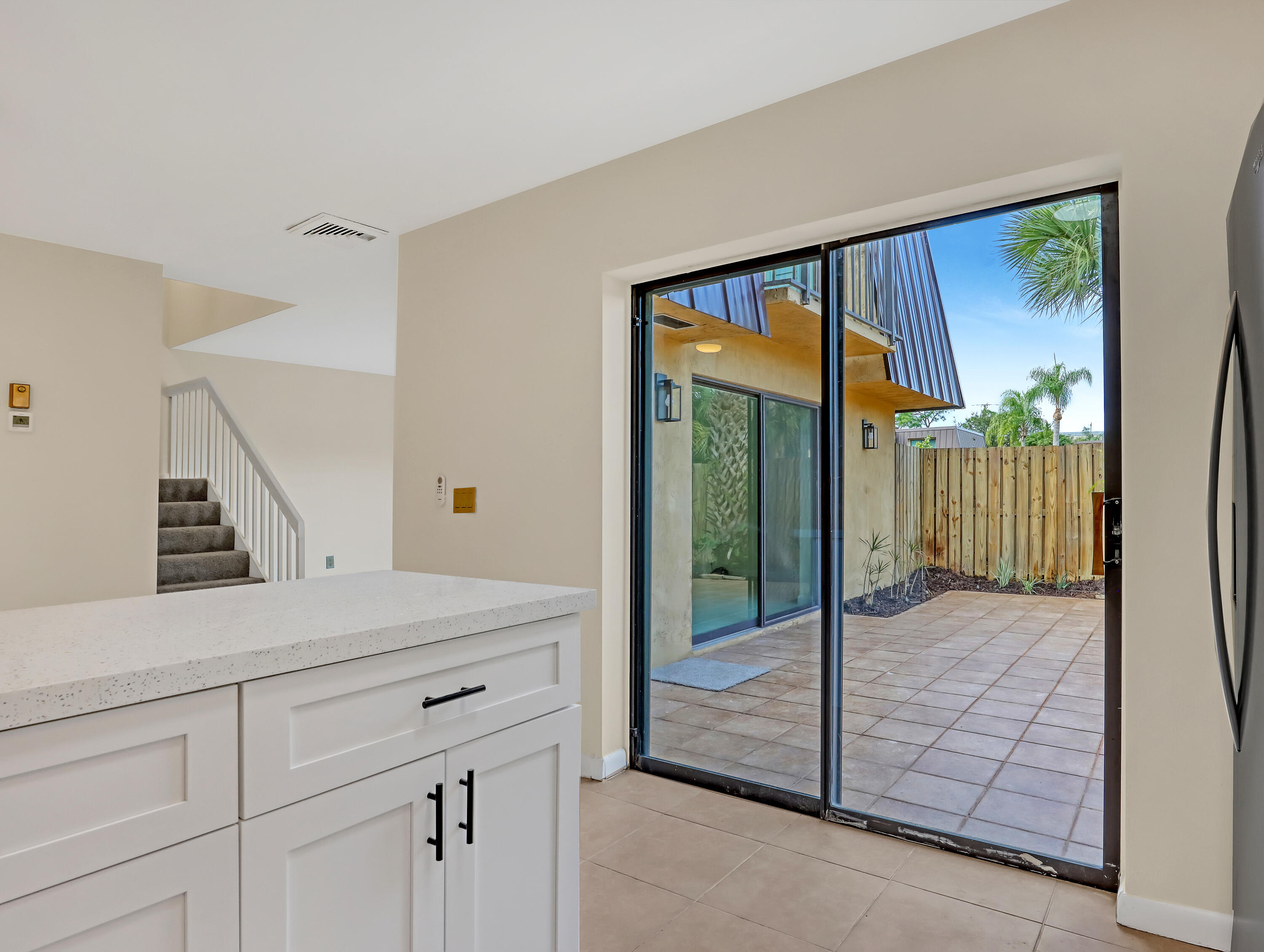 5738 Southeast Windsong Lane, Unit 315 Stuart, FL 34997 - Photo 15 of 32 a view of a hallway to a livingroom with furniture