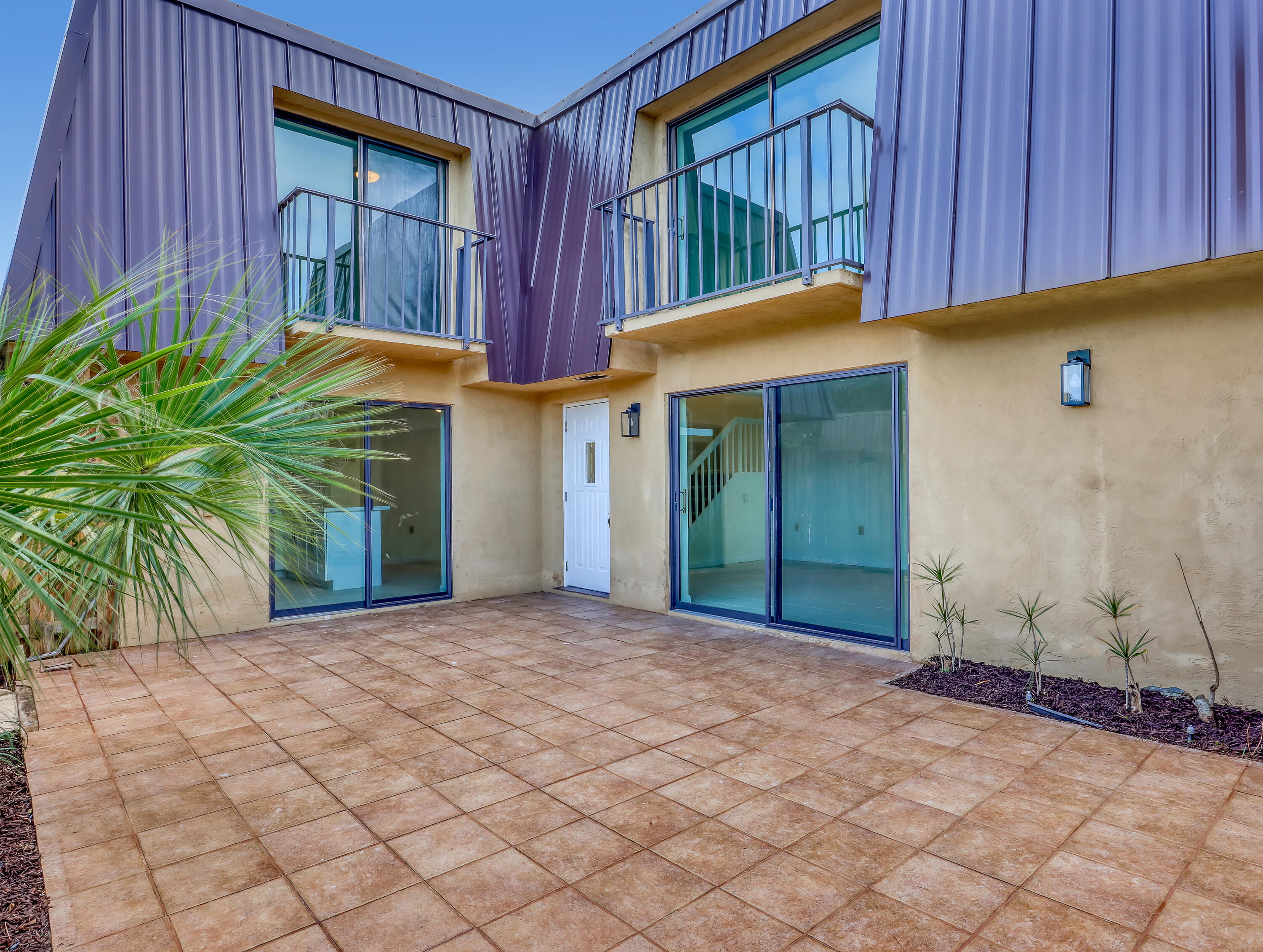5738 Southeast Windsong Lane, Unit 315 Stuart, FL 34997 - Photo 2 of 32 a view of a house with backyard