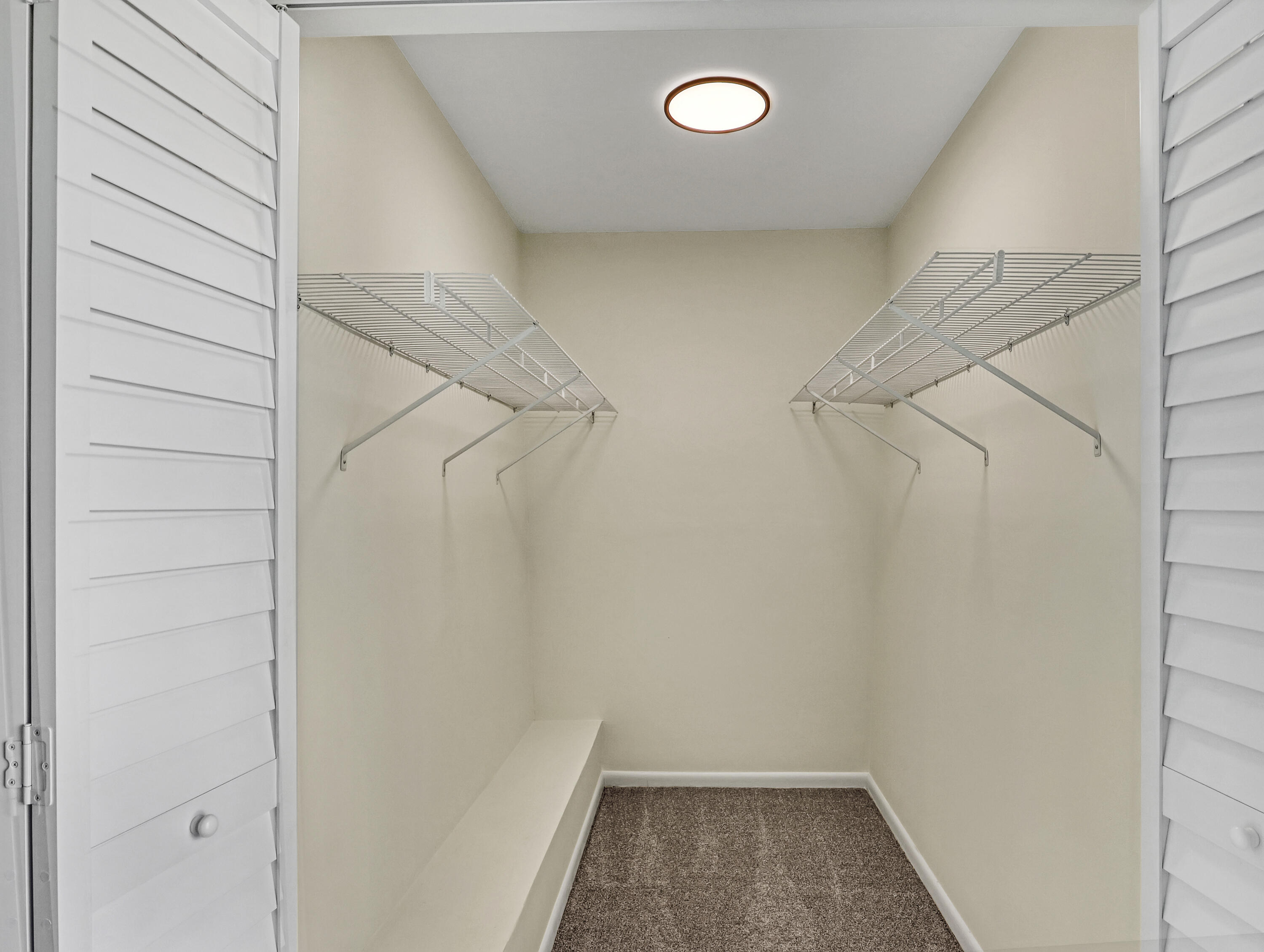 5738 Southeast Windsong Lane, Unit 315 Stuart, FL 34997 - Photo 22 of 32 a view of a room with racks on the wall