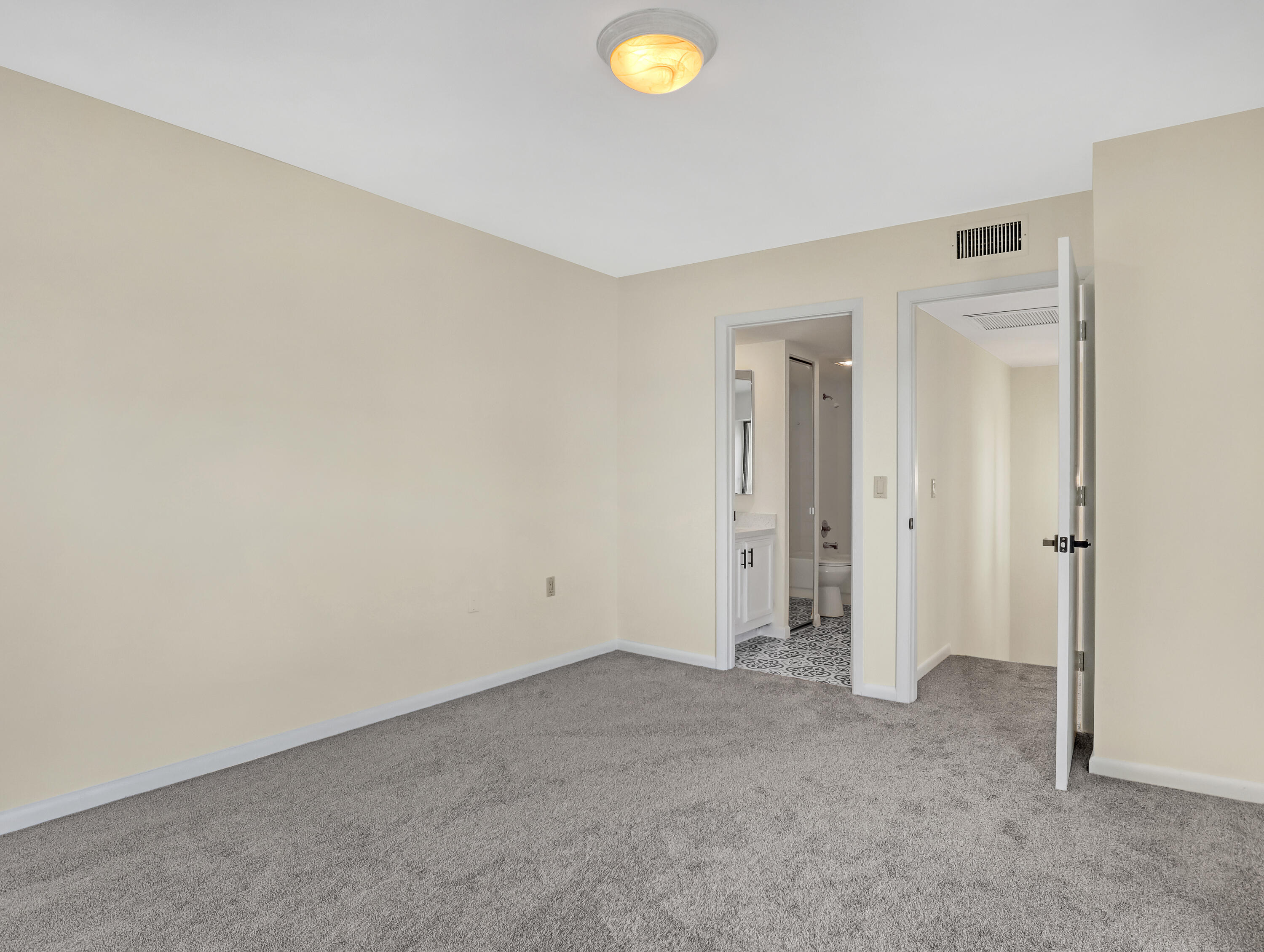 5738 Southeast Windsong Lane, Unit 315 Stuart, FL 34997 - Photo 26 of 32 a view of an empty room