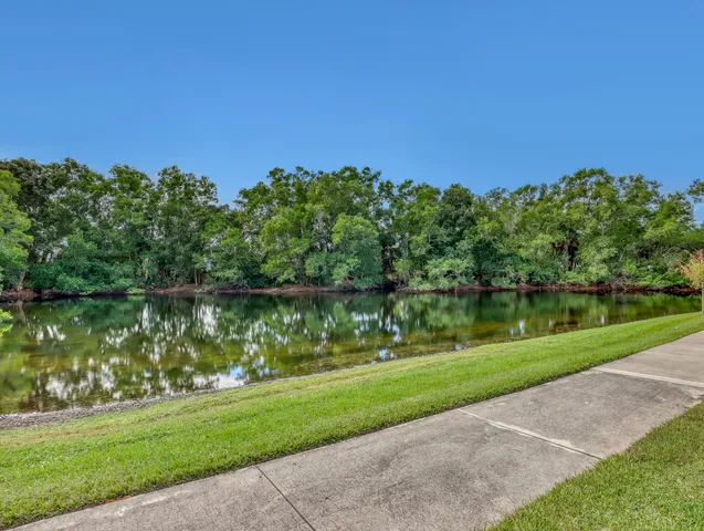 an aerial view of a house with a lake view