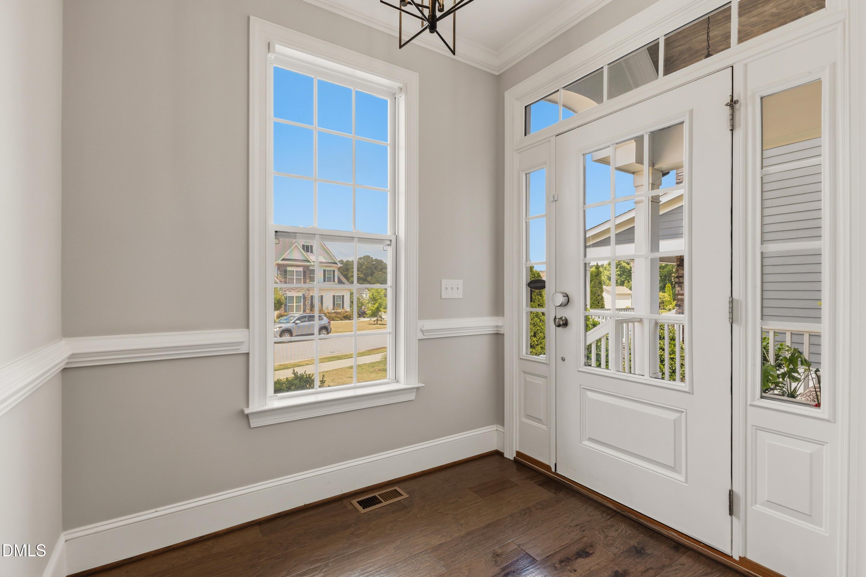 7421 Stonehenge Farm Lane Raleigh, NC 27613 - Photo 14 of 48 a view of an empty room with a window and a ceiling fan