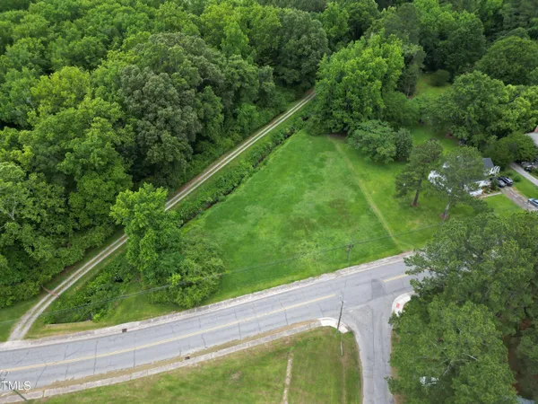 a view of a park with large trees